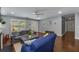Cozy living room featuring hardwood floors, ceiling fan, and lots of natural light from the bright white windows at 72 Griggs Sw St, Marietta, GA 30064