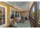 Cozy screened porch features comfortable seating and string lights at 72 Griggs Sw St, Marietta, GA 30064