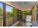 Screened porch with cozy seating, string lights, and views of the backyard at 72 Griggs Sw St, Marietta, GA 30064