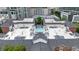 Aerial view of the property showing an inviting outdoor pool with lounge chairs in a peaceful courtyard setting at 850 Piedmont Ne Ave # 1409, Atlanta, GA 30308