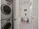 Cozy bathroom featuring a tub with shower, toilet, and stacked washer/dryer combo at 850 Piedmont Ne Ave # 1409, Atlanta, GA 30308