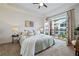 Bedroom with access to a private balcony featuring natural light and plush carpeting at 850 Piedmont Ne Ave # 1409, Atlanta, GA 30308