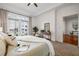 Comfortable bedroom with a balcony view, dresser, and easy access to the dining room at 850 Piedmont Ne Ave # 1409, Atlanta, GA 30308
