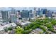 Beautiful Atlanta skyline view from the property, showcasing lush greenery and tree-lined streets below at 850 Piedmont Ne Ave # 1409, Atlanta, GA 30308