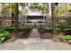 Gated entrance to private residences with lush greenery behind it at 850 Piedmont Ne Ave # 1409, Atlanta, GA 30308