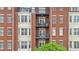 Exterior apartment building with balconies, brick facade and architectural details providing a pleasant view from the street at 850 Piedmont Ne Ave # 1409, Atlanta, GA 30308