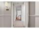 Inviting hallway with tile flooring leading to a bright living space in condo unit 1409 at 850 Piedmont Ne Ave # 1409, Atlanta, GA 30308