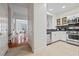 Modern kitchen featuring stainless steel appliances, white cabinets, and stylish tile flooring at 850 Piedmont Ne Ave # 1409, Atlanta, GA 30308