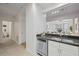 Open kitchen with stainless steel dishwasher and granite countertop, flowing into the adjacent living areas at 850 Piedmont Ne Ave # 1409, Atlanta, GA 30308