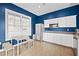 Bright kitchenette with stainless steel appliances, white cabinets, and a dining table at 850 Piedmont Ne Ave # 1409, Atlanta, GA 30308