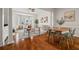 Open-concept living and dining area with hardwood floors, lots of natural light, and stylish furnishings at 850 Piedmont Ne Ave # 1409, Atlanta, GA 30308