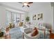 Bright living room with hardwood floors, a ceiling fan, bay windows and contemporary furniture at 850 Piedmont Ne Ave # 1409, Atlanta, GA 30308