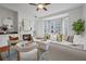Bright and airy living room with fireplace, large windows, and comfortable seating for relaxing and entertaining at 850 Piedmont Ne Ave # 1409, Atlanta, GA 30308