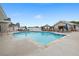 Large community pool area with lounge chairs, umbrellas, pool, and seating area at 850 Piedmont Ne Ave # 1409, Atlanta, GA 30308