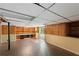 Finished basement area with wood-look flooring, shelving and walkout door at 2823 Connally Sw Dr, Atlanta, GA 30311