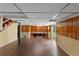 Finished basement area with wood-look flooring, shelving and walkout door at 2823 Connally Sw Dr, Atlanta, GA 30311