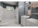Classic bathroom featuring tiled shower and floors with an updated vanity at 2823 Connally Sw Dr, Atlanta, GA 30311