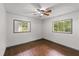 Bright bedroom featuring hardwood floors, a ceiling fan, and natural light at 2823 Connally Sw Dr, Atlanta, GA 30311