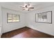 Bedroom with wood floors, ceiling fan, and two windows offering natural light at 2823 Connally Sw Dr, Atlanta, GA 30311
