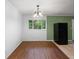 The dining room has wood floors, a chandelier, and a large window at 2823 Connally Sw Dr, Atlanta, GA 30311