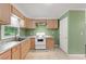Cozy kitchen with granite countertops, white appliances and tile flooring at 2823 Connally Sw Dr, Atlanta, GA 30311