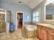 A spacious bathroom features a walk-in shower, soaking tub, and walk-in closet at 2859 Seagrave Way, Marietta, GA 30066