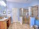 Light-filled bathroom featuring a walk-in shower and vanity with ample counter space at 2859 Seagrave Way, Marietta, GA 30066