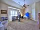 Spacious bonus room featuring an exercise bike, sewing station, and ample natural light at 2859 Seagrave Way, Marietta, GA 30066