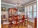 Elegant dining room with a chandelier, large windows, and a beautiful wooden table and chairs at 2859 Seagrave Way, Marietta, GA 30066