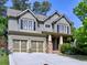 Charming two-story home featuring a two-car garage, inviting front porch, and stylish architectural details at 2859 Seagrave Way, Marietta, GA 30066