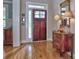 Charming foyer with hardwood floors and antique sideboard offers a glimpse into the well-appointed home at 2859 Seagrave Way, Marietta, GA 30066