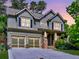Charming two-story home featuring a two-car garage, well-maintained lawn, and landscaped garden beds at 2859 Seagrave Way, Marietta, GA 30066