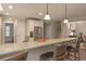 Bright kitchen with stainless appliances, a long breakfast bar, and modern pendant lighting offers a great gathering space at 2859 Seagrave Way, Marietta, GA 30066