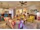 Open concept living area with fireplace, ceiling fan, and view of the breakfast bar offers an inviting gathering space at 2859 Seagrave Way, Marietta, GA 30066