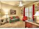 Cozy living room with built-in bookshelves, a green love seat, and lots of natural light at 2859 Seagrave Way, Marietta, GA 30066