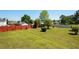 Expansive backyard featuring a well-maintained lawn and a wooden privacy fence at 9482 Deer Crossing Ln, Jonesboro, GA 30236