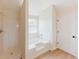 Bathroom featuring a shower and tub combo with tile surround at 9482 Deer Crossing Ln, Jonesboro, GA 30236
