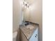 Bathroom vanity with granite counters, modern lighting, and sleek design at 9482 Deer Crossing Ln, Jonesboro, GA 30236