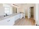 Bathroom with double vanity, granite counters, and ample storage space at 9482 Deer Crossing Ln, Jonesboro, GA 30236