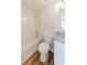 Bright bathroom featuring a bathtub and shower, and a modern vanity at 9482 Deer Crossing Ln, Jonesboro, GA 30236