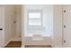 Bathroom featuring a shower and tub combo with tile surround at 9482 Deer Crossing Ln, Jonesboro, GA 30236