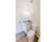 A bathroom with granite countertop vanity, a shower-tub combo, and modern lighting at 9482 Deer Crossing Ln, Jonesboro, GA 30236