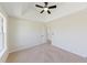 Bright bedroom with neutral carpet and trim featuring a ceiling fan at 9482 Deer Crossing Ln, Jonesboro, GA 30236