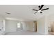 Large bonus room with ceiling fan and access to bathroom and bedrooms at 9482 Deer Crossing Ln, Jonesboro, GA 30236