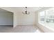 This dining area features modern lighting, fresh paint, and is located off the living room, perfect for entertaining at 9482 Deer Crossing Ln, Jonesboro, GA 30236