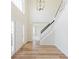 Two-story foyer with hardwood floors and staircase at 9482 Deer Crossing Ln, Jonesboro, GA 30236