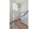 Welcoming foyer with hardwood floors, stairs, a modern chandelier, and ample natural light at 9482 Deer Crossing Ln, Jonesboro, GA 30236