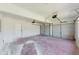 Spacious two car garage with automatic doors, concrete floor, and ample room for parking at 9482 Deer Crossing Ln, Jonesboro, GA 30236