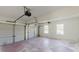Two-car garage with automatic doors, great space for vehicles and storage at 9482 Deer Crossing Ln, Jonesboro, GA 30236