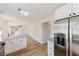 Modern kitchen with white cabinets, stainless steel appliances, and granite countertops, offers a spacious workspace at 9482 Deer Crossing Ln, Jonesboro, GA 30236